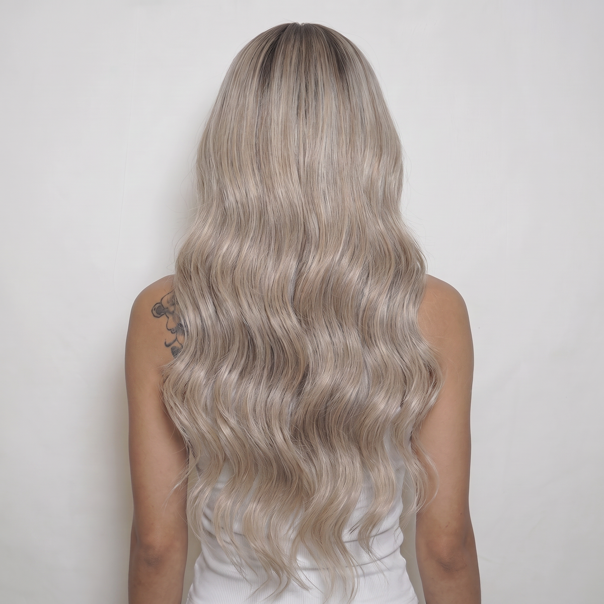 WIGZ 44 - Full back view of 24 inch 180% density WAVY ASH BLONDE wig.