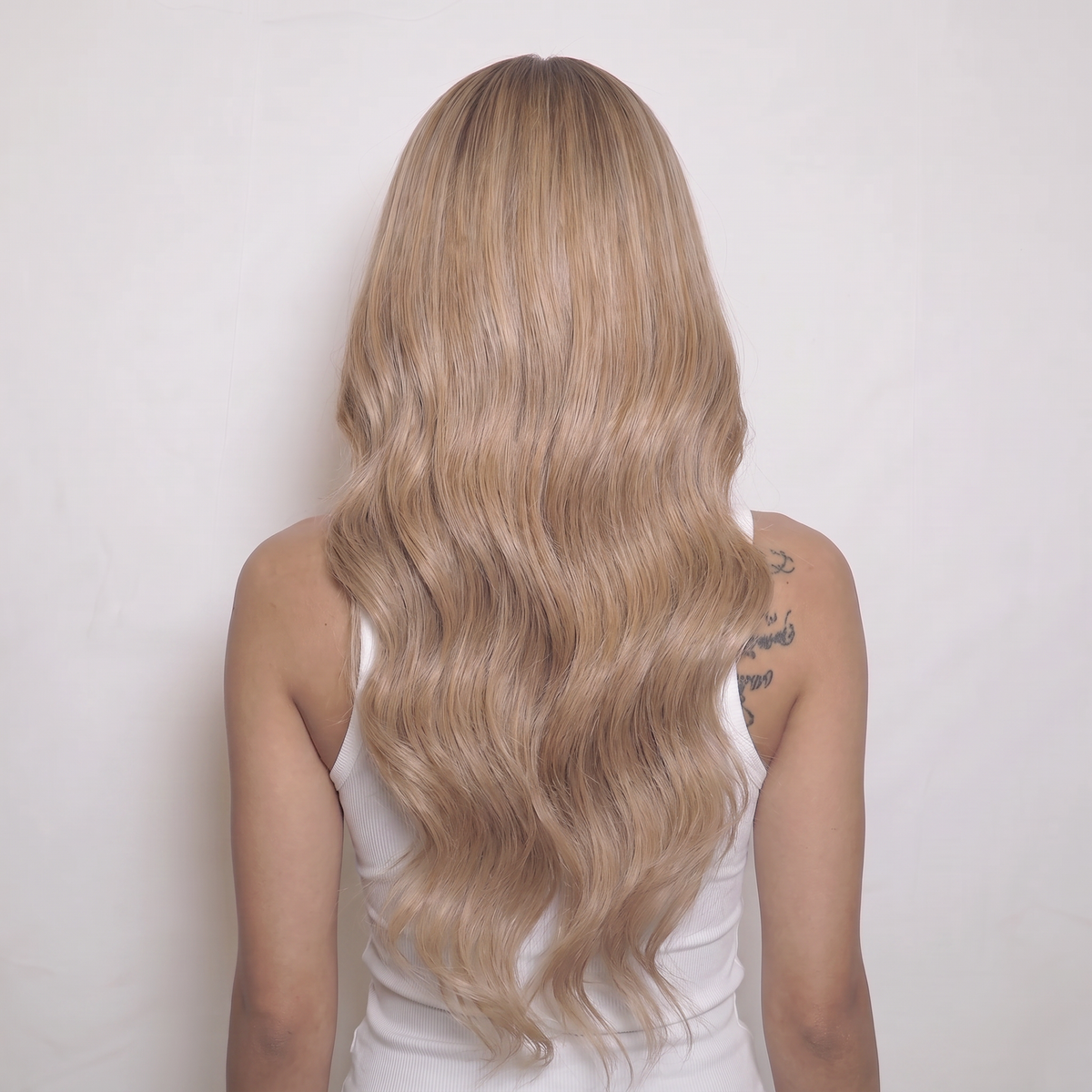 WIGZ 50 - Full back view of 24 inch 180% density WAVY BLONDE BALAYAGE wig.