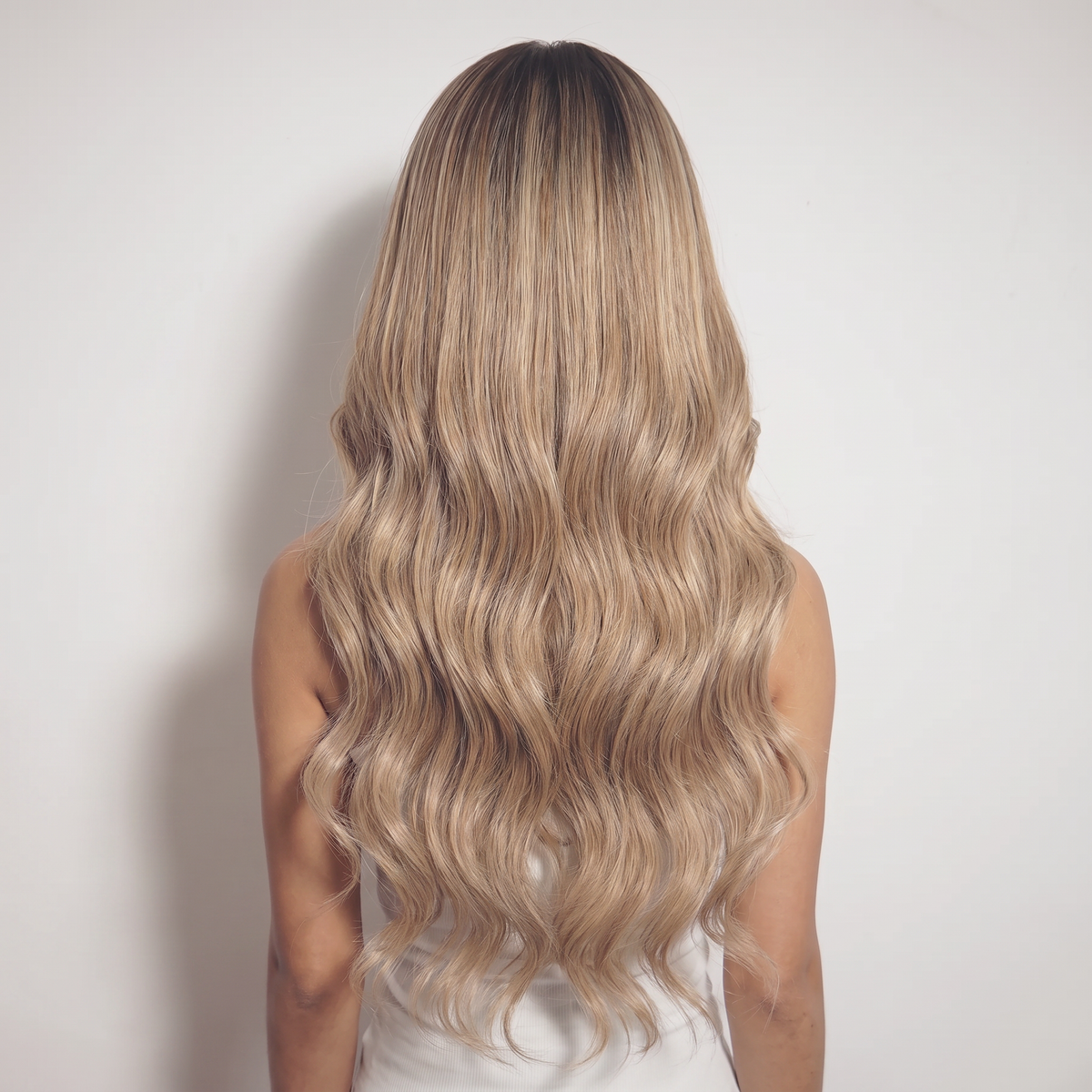 WIGZ 52 - Full back view of 24 inch 180% density WAVY HONEY BLONDE BALAYAGE wig.