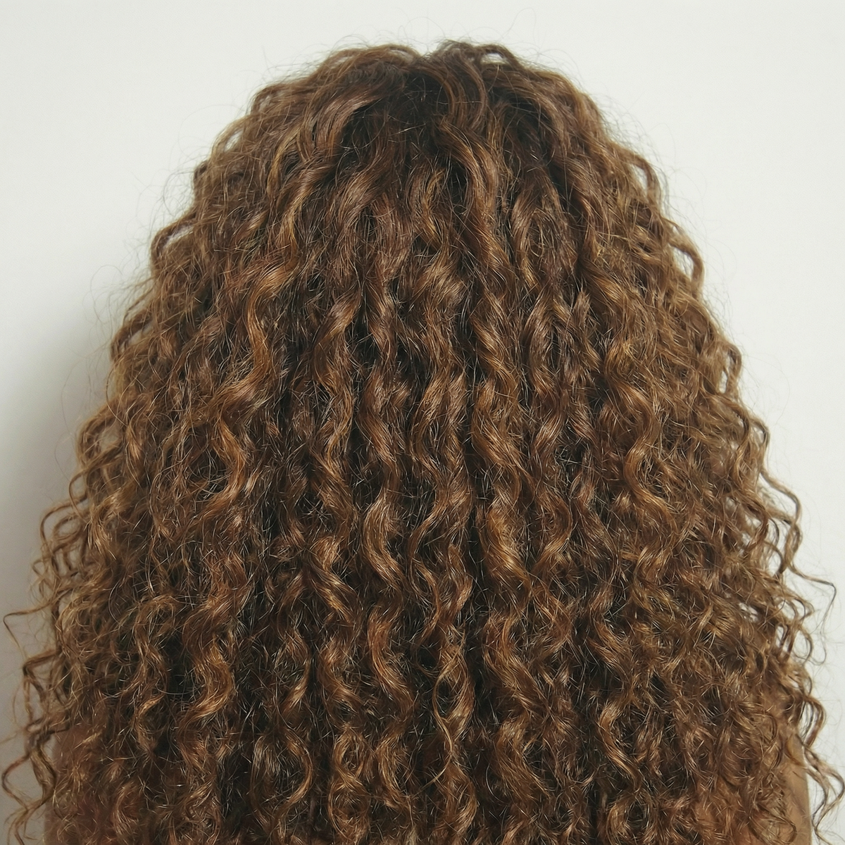 WIGZ 07 - Macro close-up of CURLY BALAYAGE WARM BRUNETTE PURE-VIRGIN HAIR™ texture and shine.