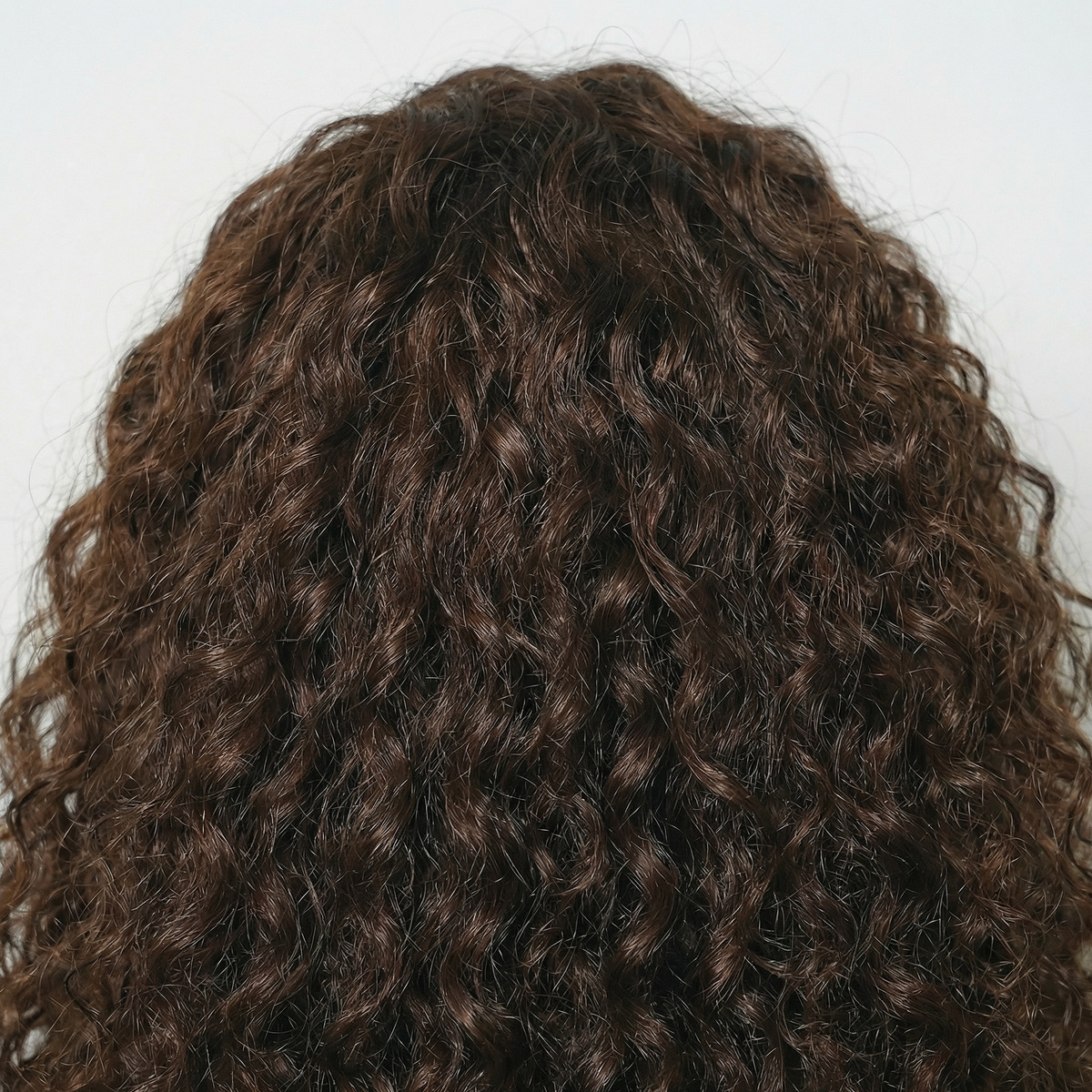 WIGZ 08 - Macro close-up of CURLY CHOCOLATE PURE-VIRGIN HAIR™ texture and shine.