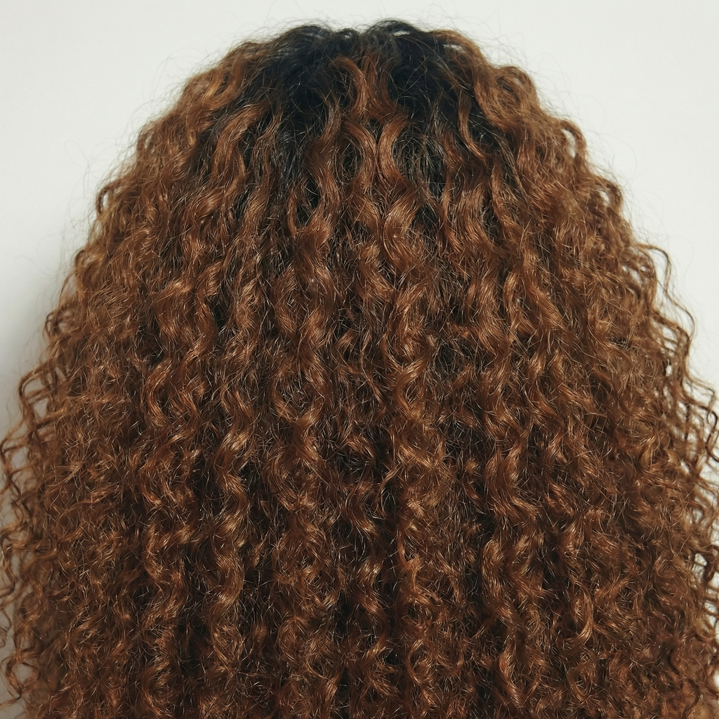 WIGZ 11 - Macro close-up of CURLY ROOTED CINNAMON BROWN PURE-VIRGIN HAIR™ texture and shine.