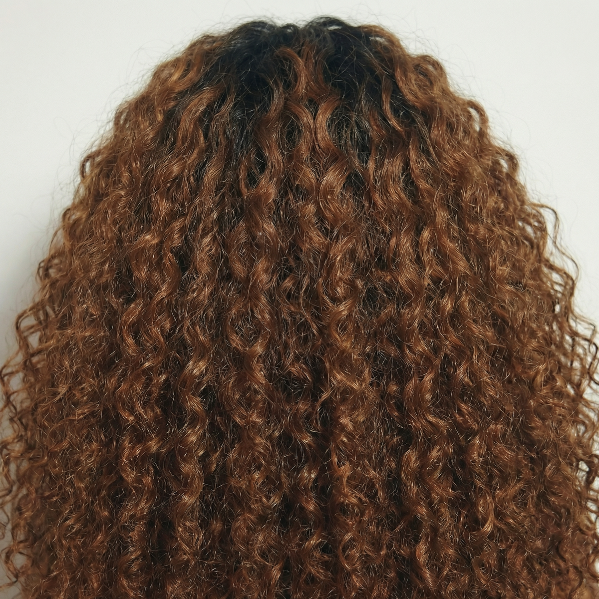WIGZ 11 - Macro close-up of CURLY ROOTED CINNAMON BROWN PURE-VIRGIN HAIR™ texture and shine.