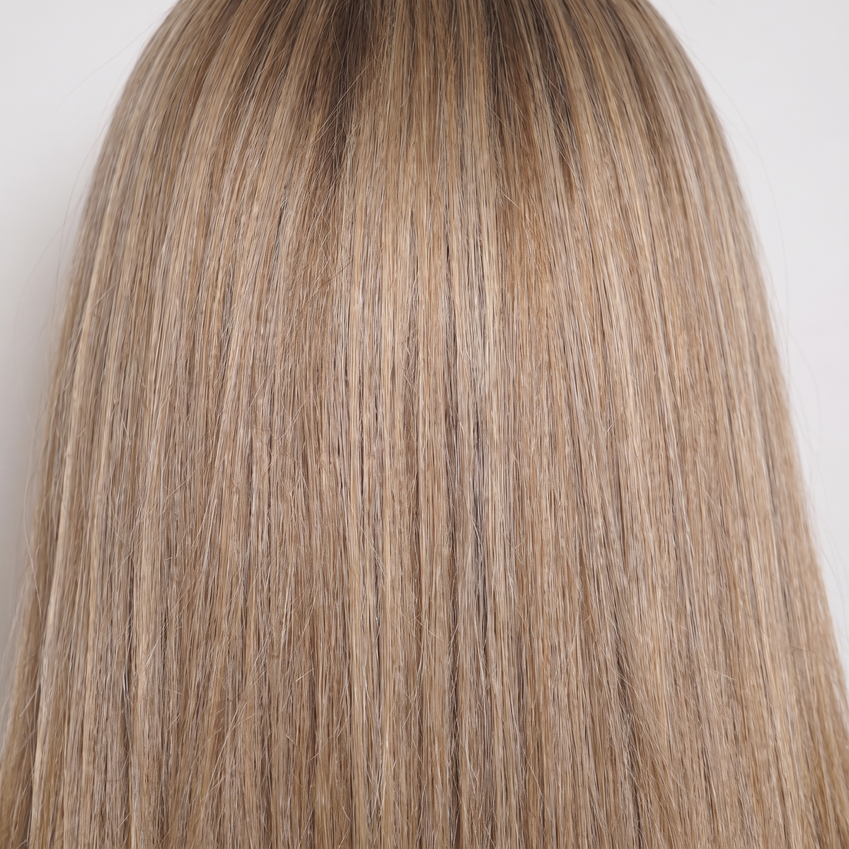 WIGZ 40 - Macro close-up of STRAIGHT BALAYAGE BLONDE PURE-VIRGIN HAIR™ texture and shine.