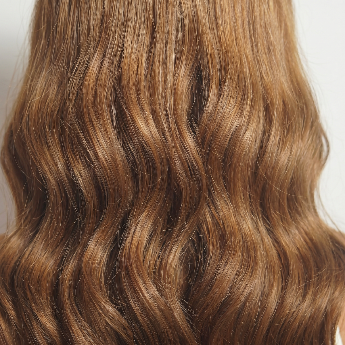 WIGZ 26 - Macro close-up of WAVY BROWN PURE-VIRGIN HAIR™ texture and shine.