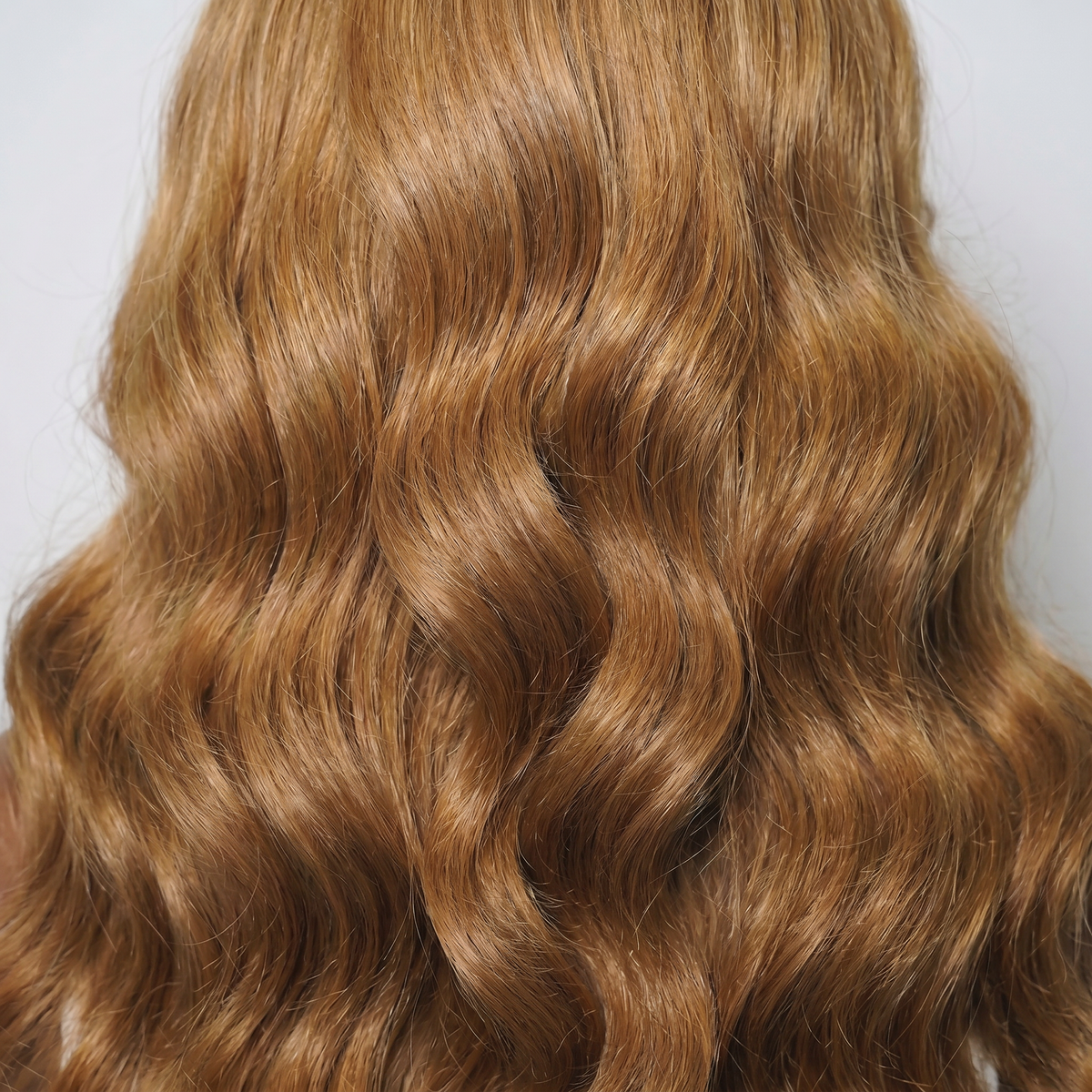 WIGZ 28 - Macro close-up of WAVY HONEY PURE-VIRGIN HAIR™ texture and shine.