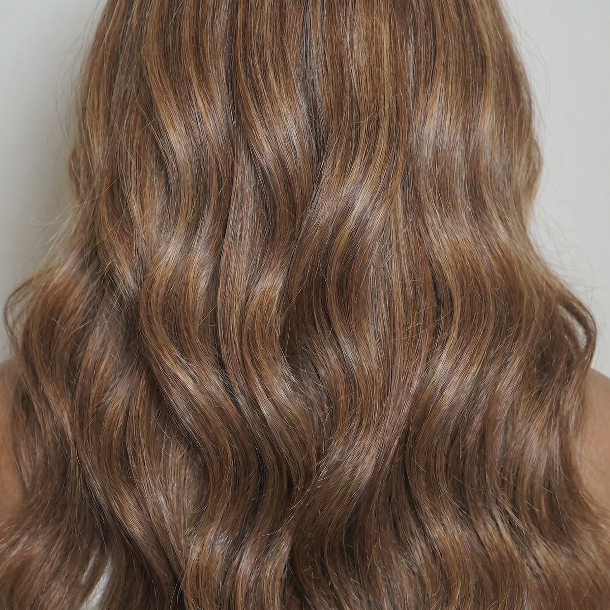 WIGZ 30 - Macro close-up of WAVY CARAMEL PURE-VIRGIN HAIR™ texture and shine.