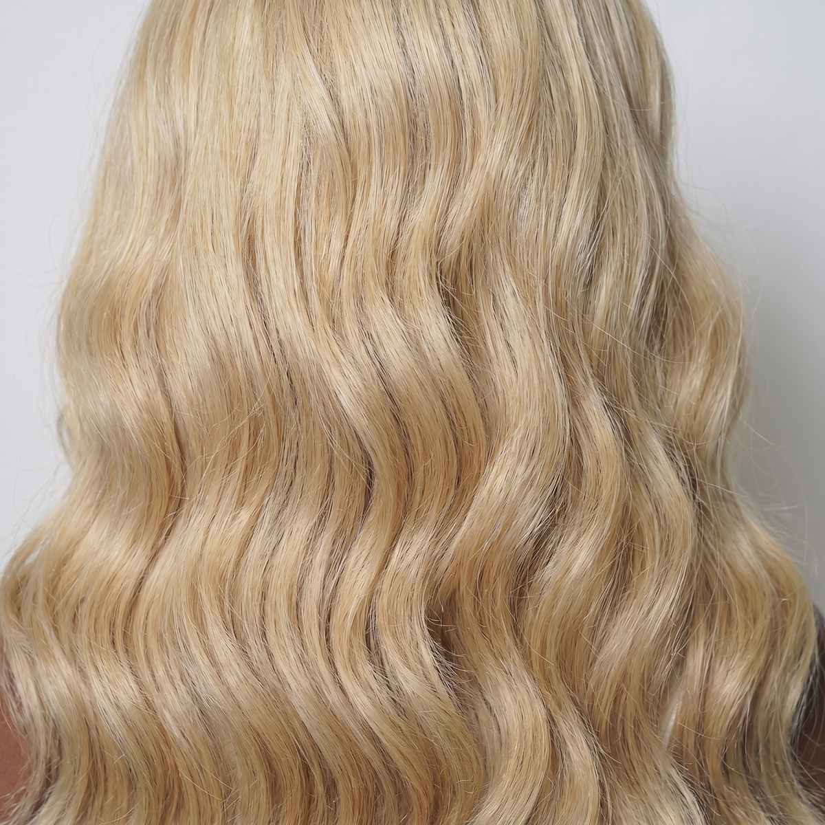 WIGZ 31 - Macro close-up of WAVY GOLDEN BLONDE PURE-VIRGIN HAIR™ texture and shine.