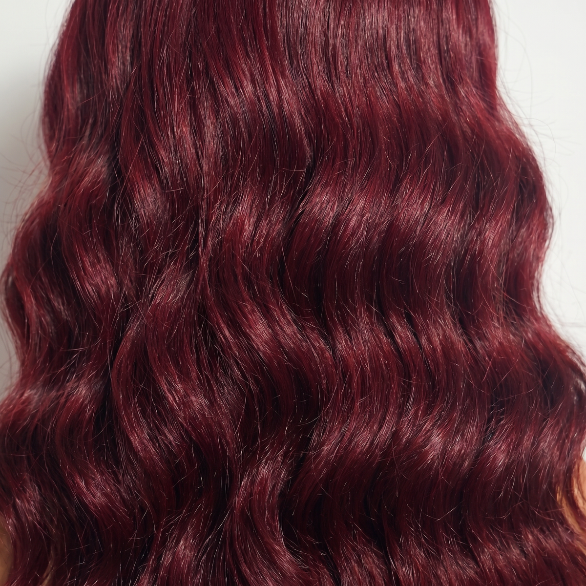 WIGZ 32 - Macro close-up of WAVY BURGUNDY PURE-VIRGIN HAIR™ texture and shine.
