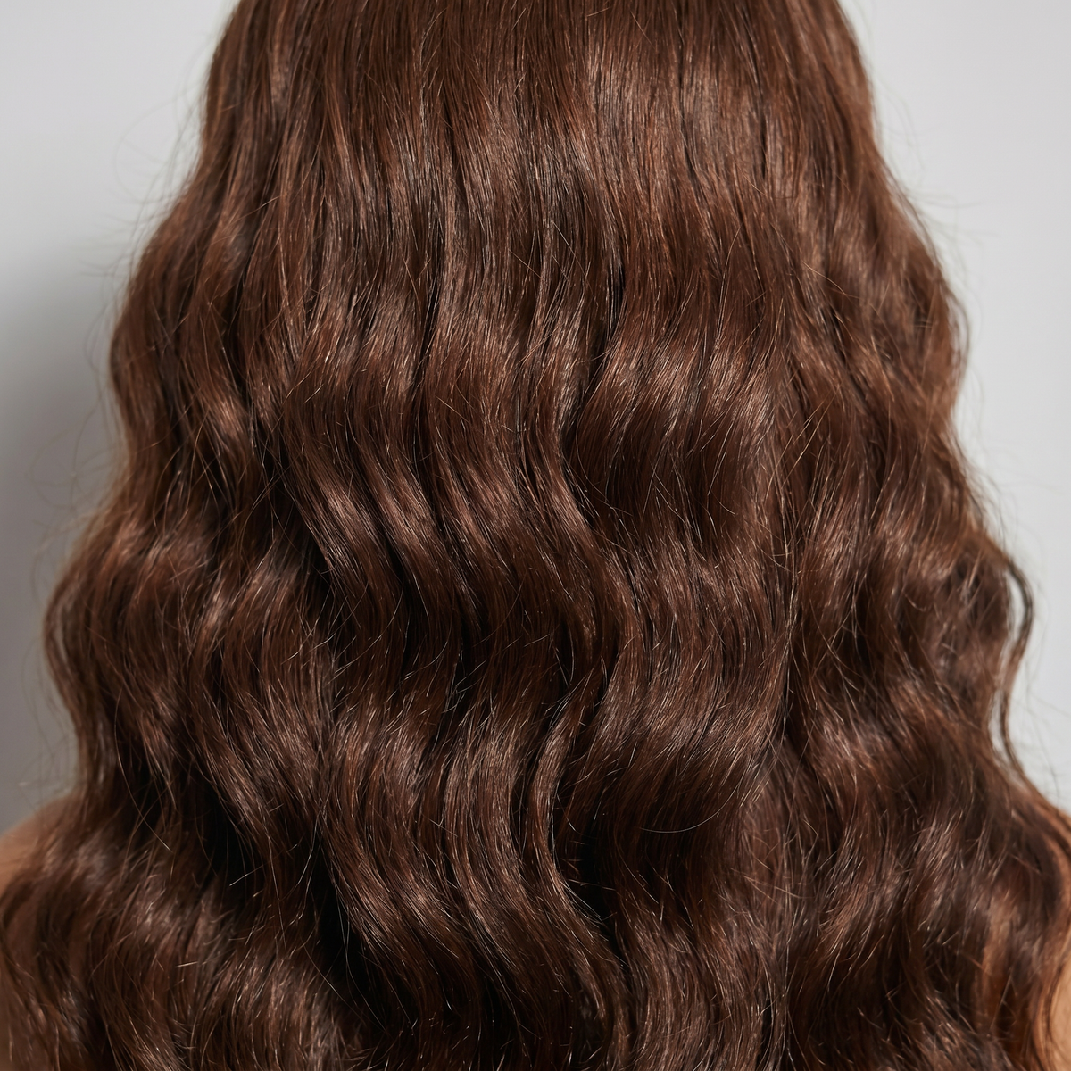 WIGZ 33 - Macro close-up of WAVY CHESTNUT PURE-VIRGIN HAIR™ texture and shine.