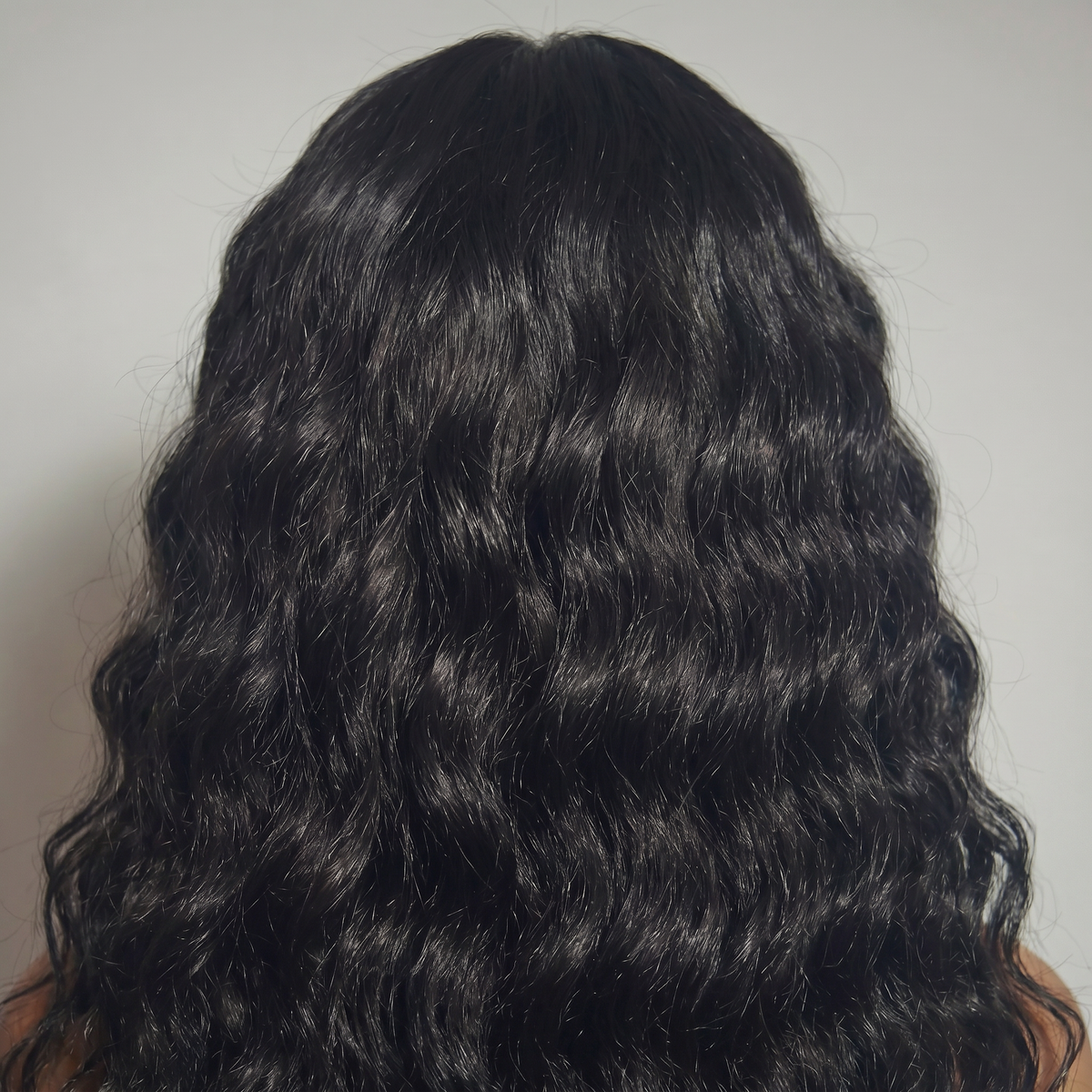 WIGZ 34 - Macro close-up of WAVY JET BLACK PURE-VIRGIN HAIR™ texture and shine.