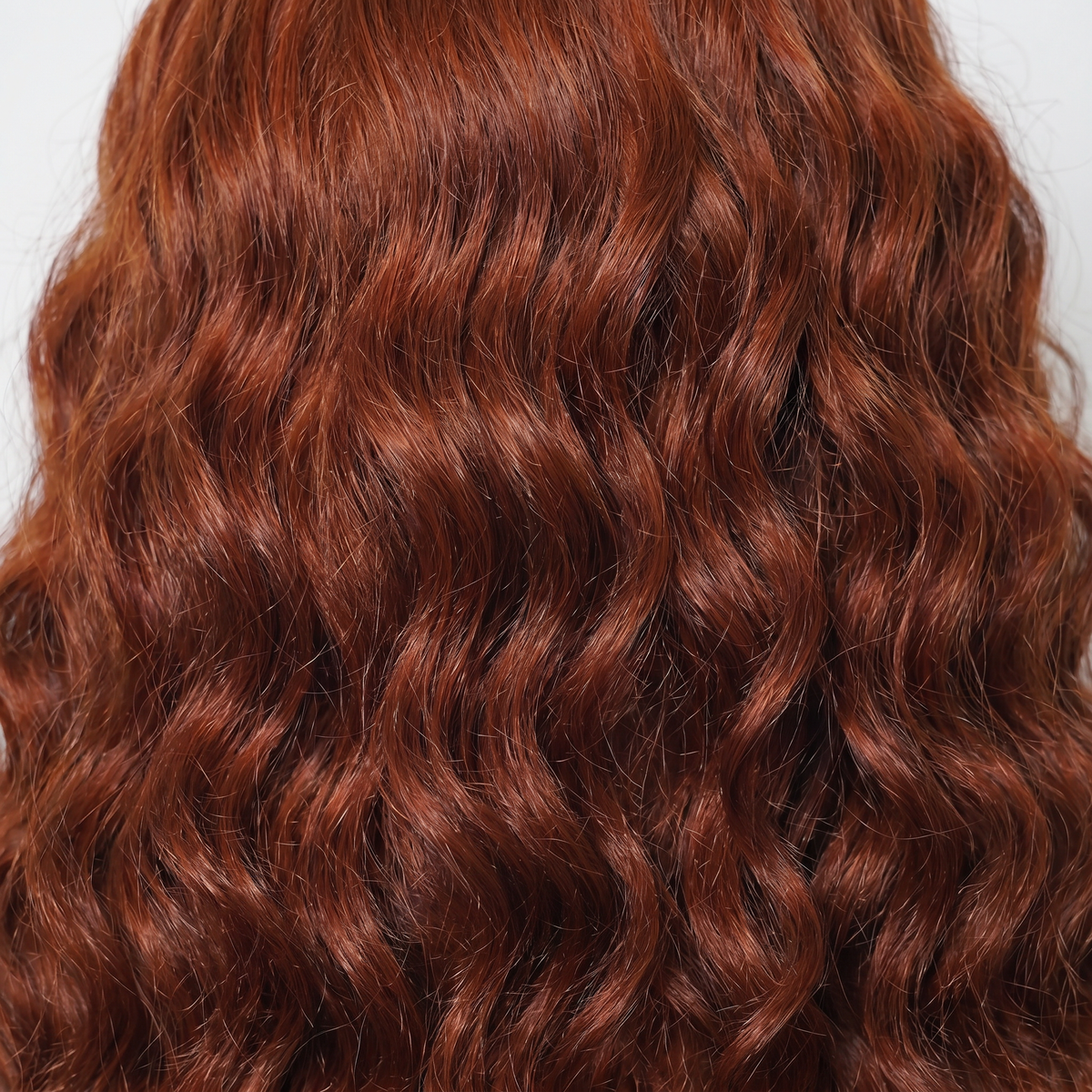 WIGZ 36 - Macro close-up of WAVY AUBURN PURE-VIRGIN HAIR™ texture and shine.