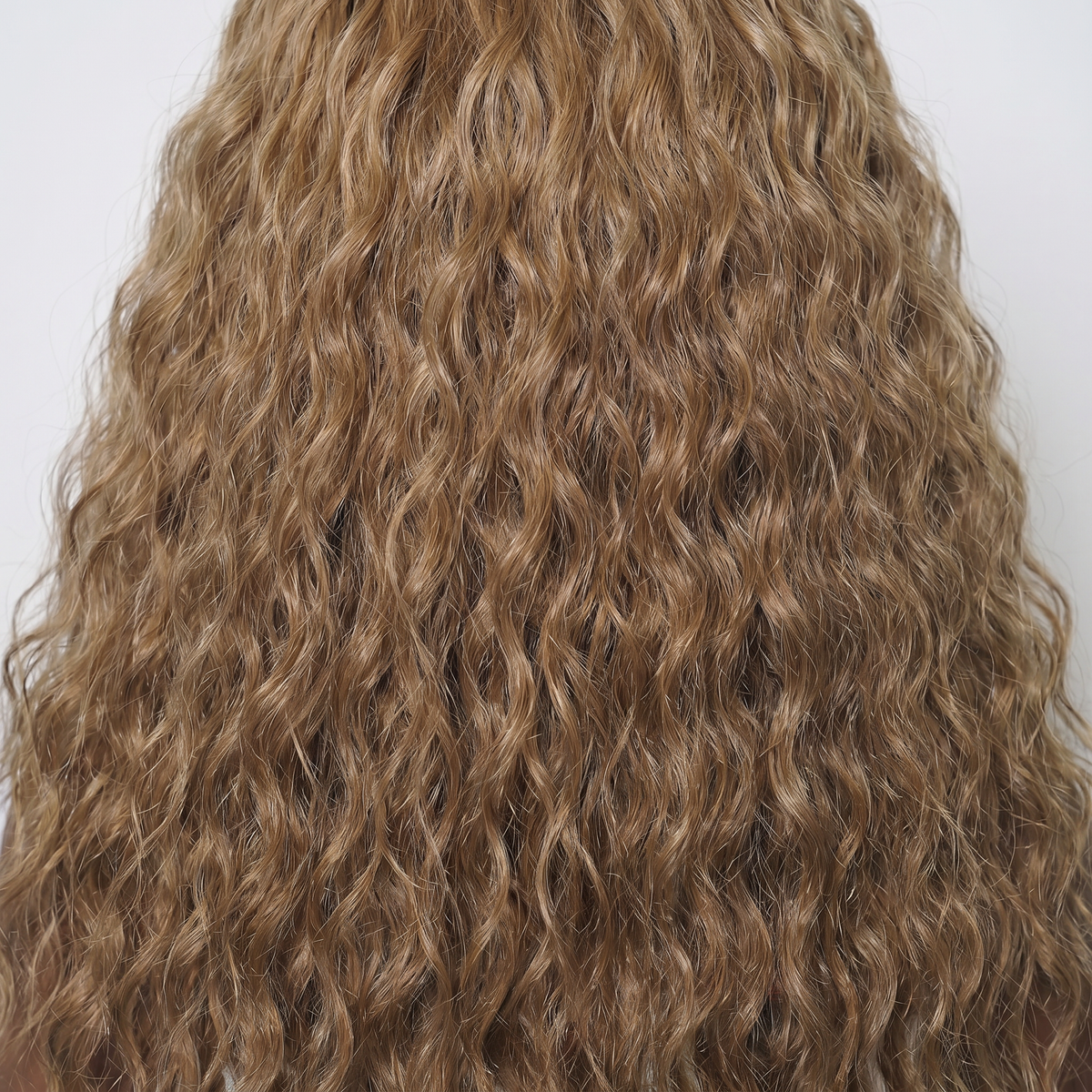 WIGZ 37 - Macro close-up of WAVY BLONDE PURE-VIRGIN HAIR™ texture and shine.