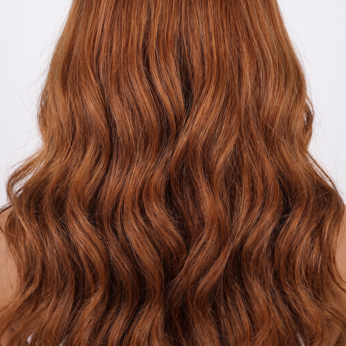 WIGZ 49 - Macro close-up of WAVY AUBURN HIGHLIGHTS PURE-VIRGIN HAIR™ texture and shine.