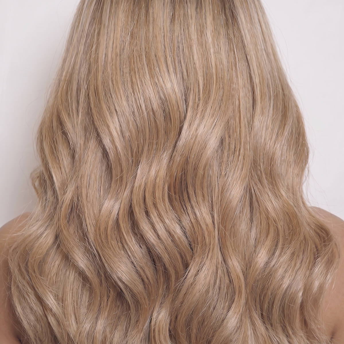 WIGZ 50 - Macro close-up of WAVY BLONDE BALAYAGE PURE-VIRGIN HAIR™ texture and shine.