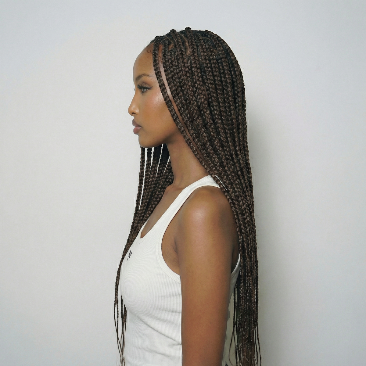 WIGZ 03 - Side profile view of layered AFRO BOX BRAIDS virgin hair wig with WIGZ LAB CAP™.