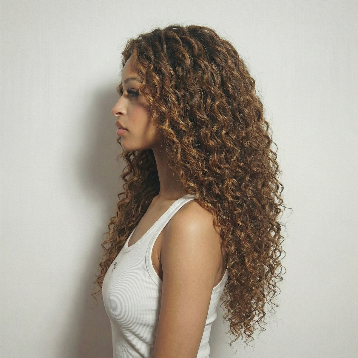 WIGZ 07 - Side profile view of layered CURLY BALAYAGE WARM BRUNETTE virgin hair wig with WIGZ LAB CAP™.