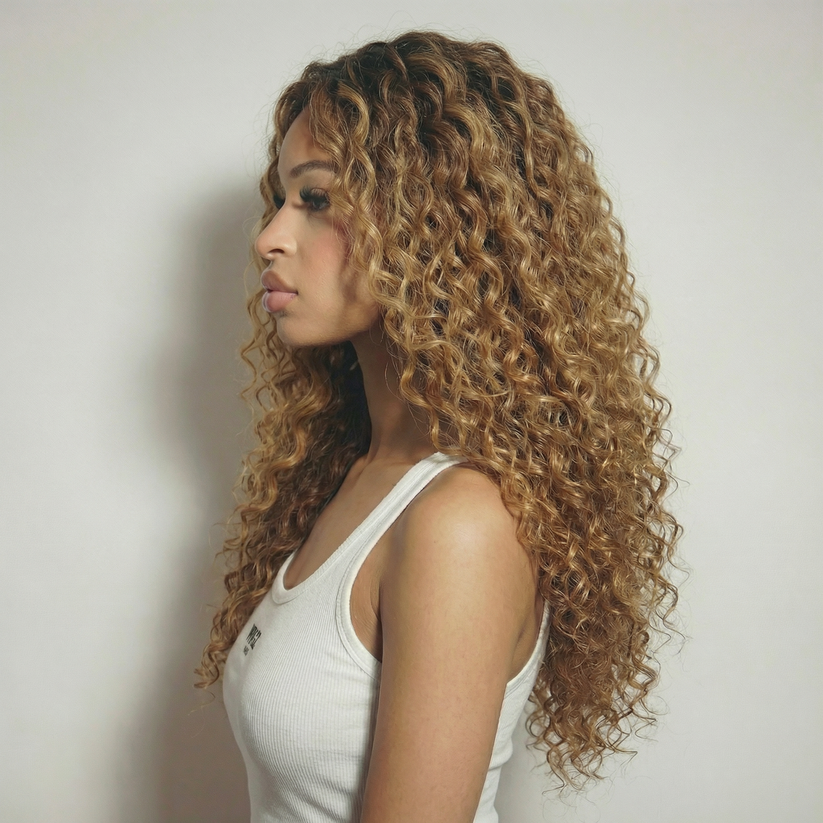 WIGZ 10 - Side profile view of layered CURLY BLONDE BALAYAGE virgin hair wig with WIGZ LAB CAP™.