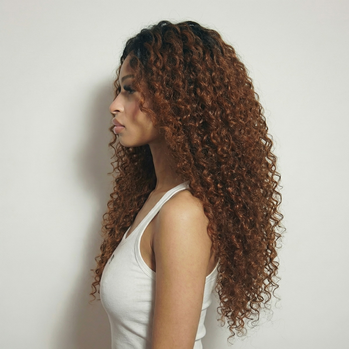 WIGZ 11 - Side profile view of layered CURLY ROOTED CINNAMON BROWN virgin hair wig with WIGZ LAB CAP™.