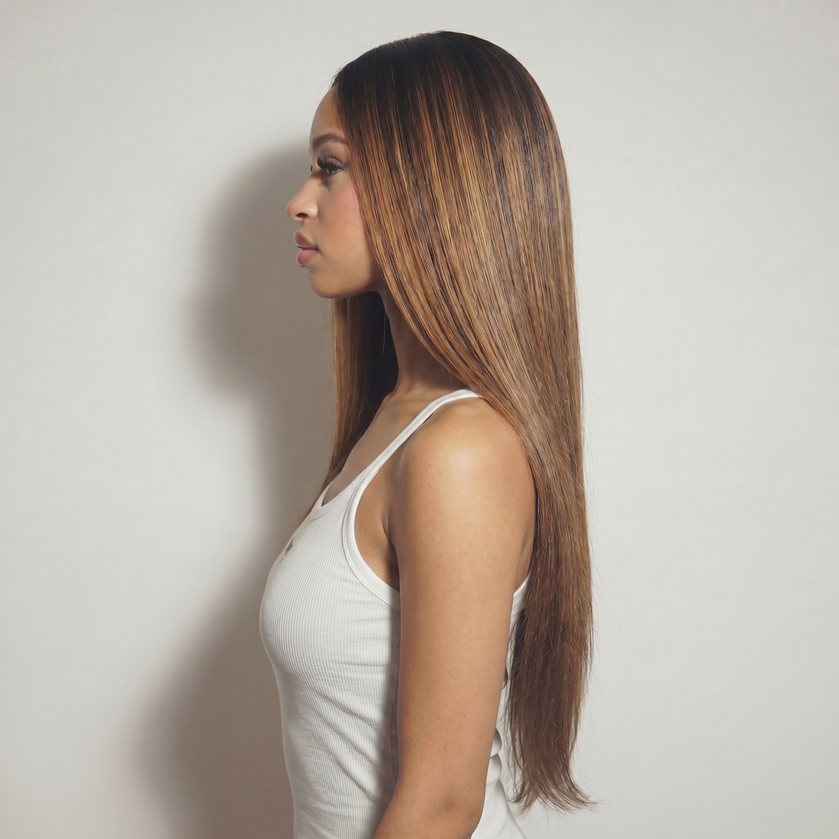 WIGZ 14 - Side profile view of layered STRAIGHT ROOTED DARK BROWN virgin hair wig with WIGZ LAB CAP™.