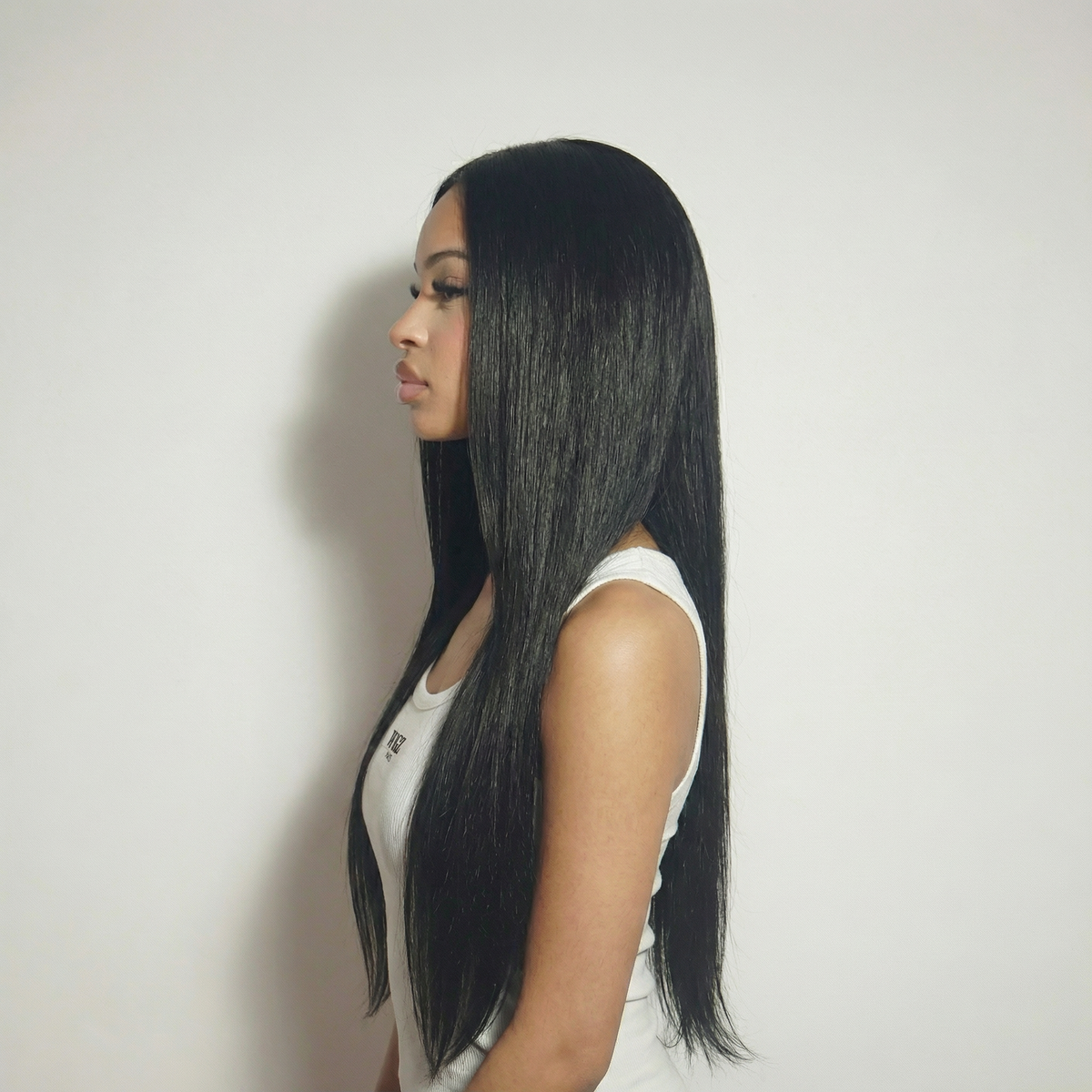 WIGZ 18 - Side profile view of layered STRAIGHT BLACK virgin hair wig with WIGZ LAB CAP™.