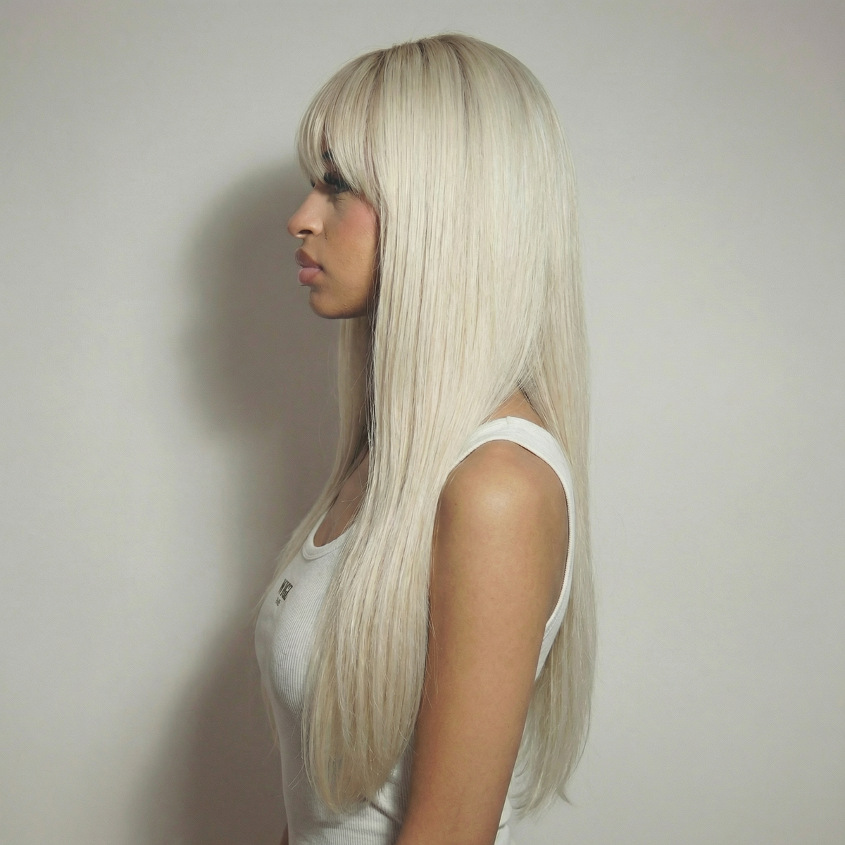 WIGZ 20 - Side profile view of layered STRAIGHT PLATINUM virgin hair wig with WIGZ LAB CAP™.