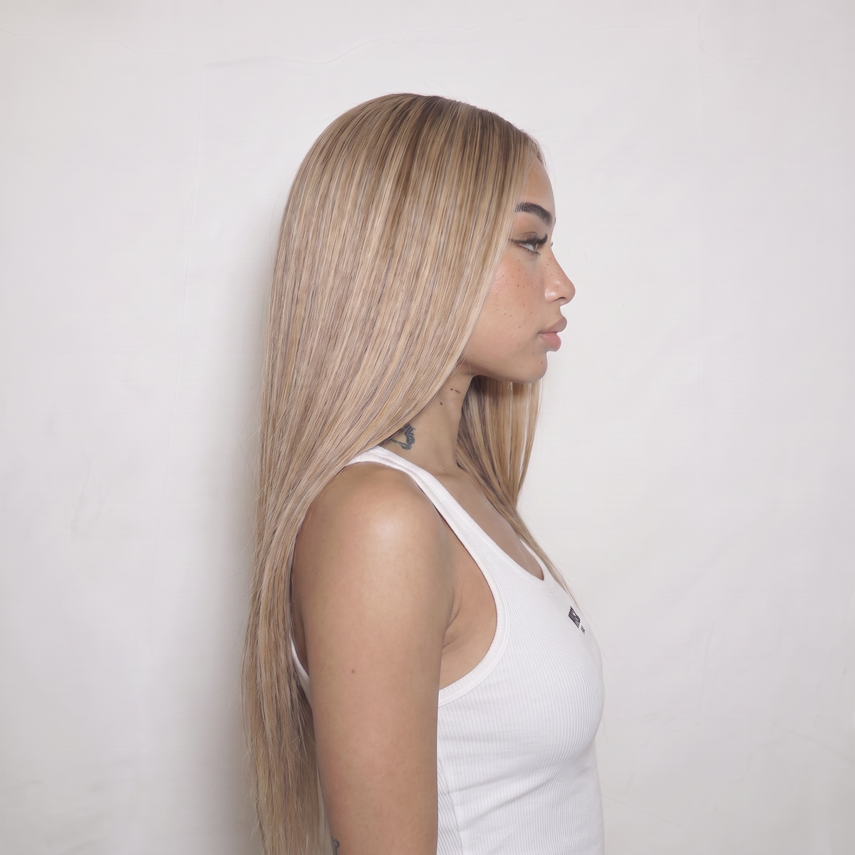 WIGZ 40 - Side profile view of layered STRAIGHT BALAYAGE BLONDE virgin hair wig with WIGZ LAB CAP™.
