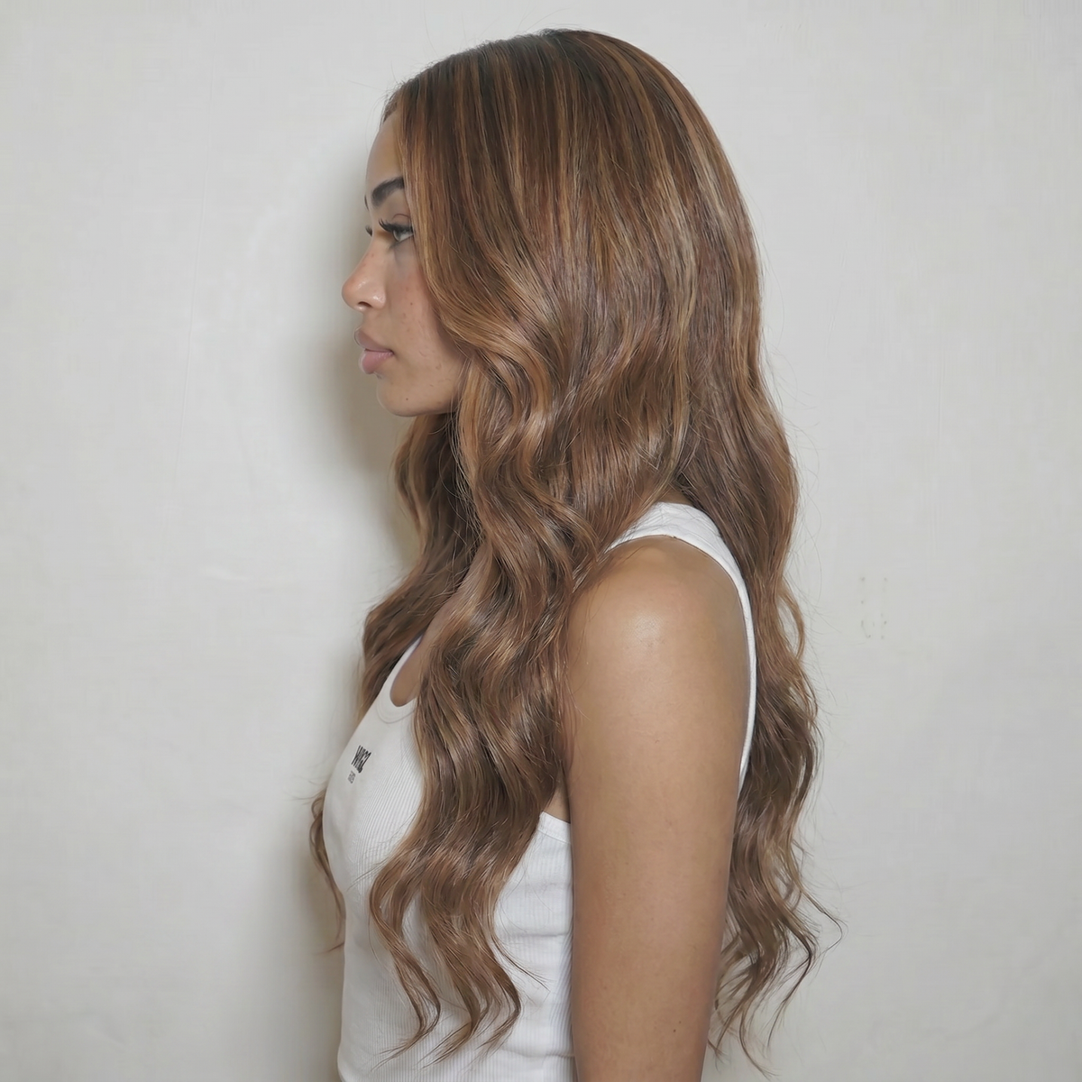 WIGZ 30 - Side profile view of layered WAVY CARAMEL virgin hair wig with WIGZ LAB CAP™.