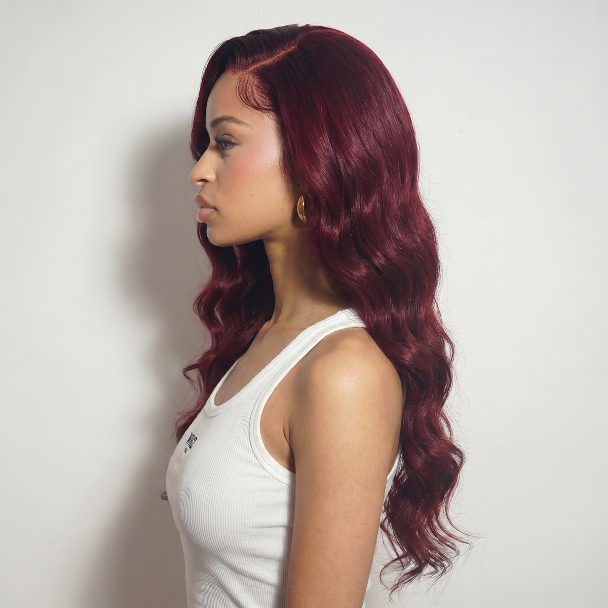 WIGZ 32 - Side profile view of layered WAVY BURGUNDY virgin hair wig with WIGZ LAB CAP™.