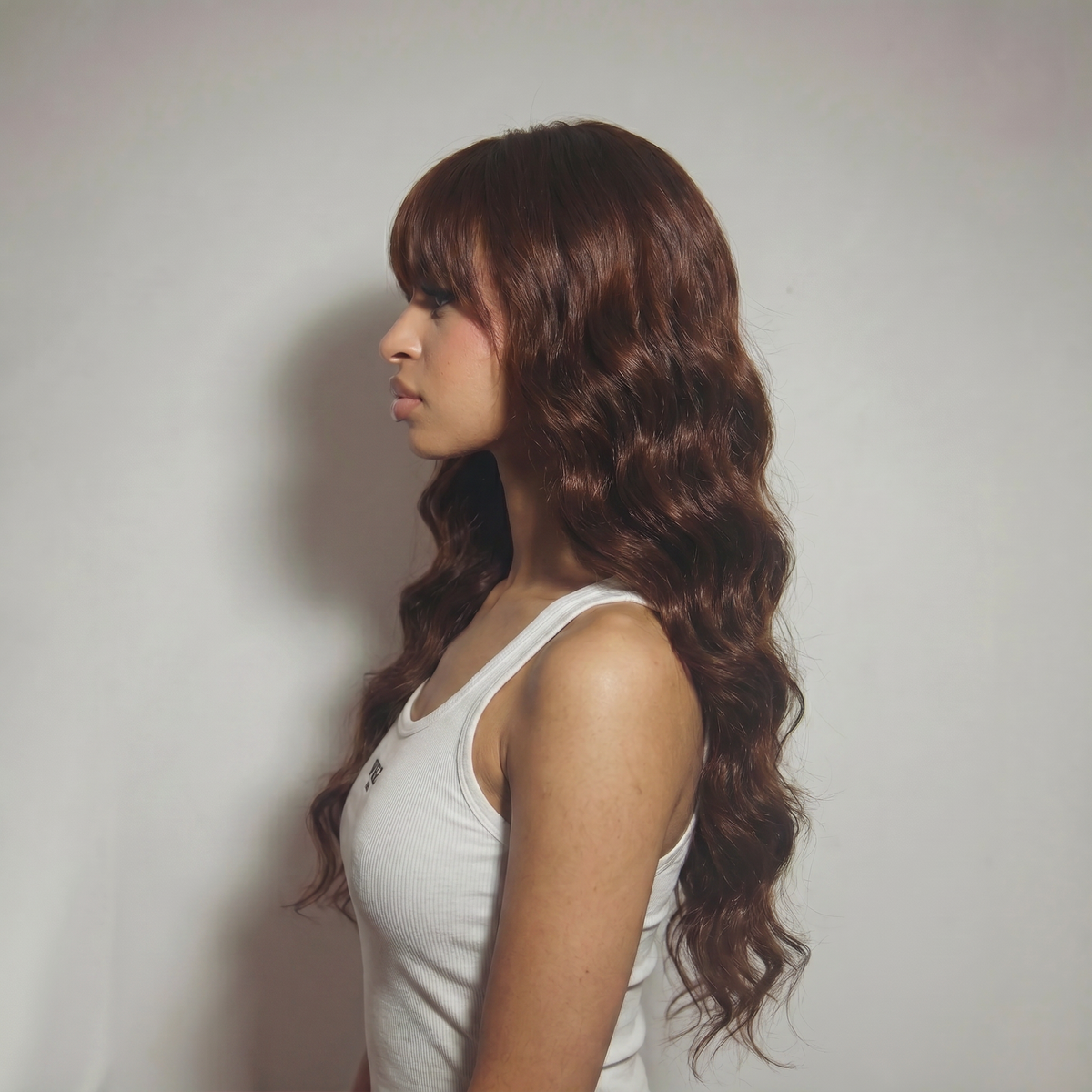WIGZ 33 - Side profile view of layered WAVY CHESTNUT virgin hair wig with WIGZ LAB CAP™.