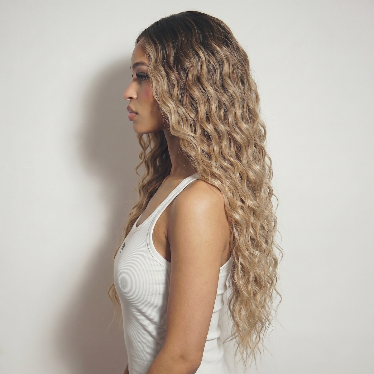 WIGZ 38 - Side profile view of layered WAVY BALAYAGE DARK BROWN TO BLONDE virgin hair wig with WIGZ LAB CAP™.