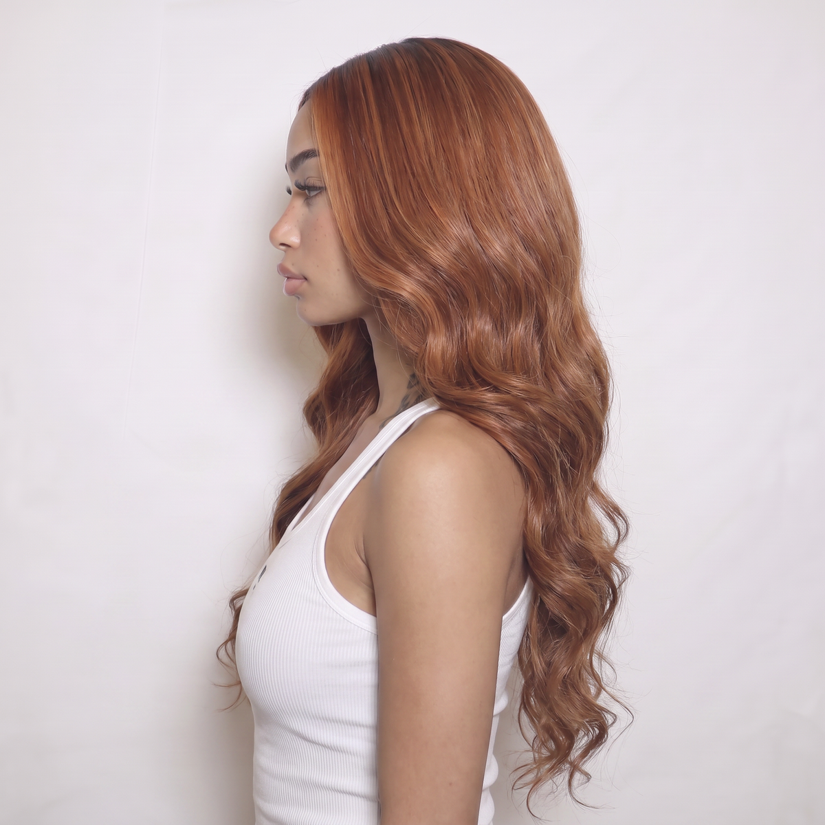WIGZ 49 - Side profile view of layered WAVY AUBURN HIGHLIGHTS virgin hair wig with WIGZ LAB CAP™.