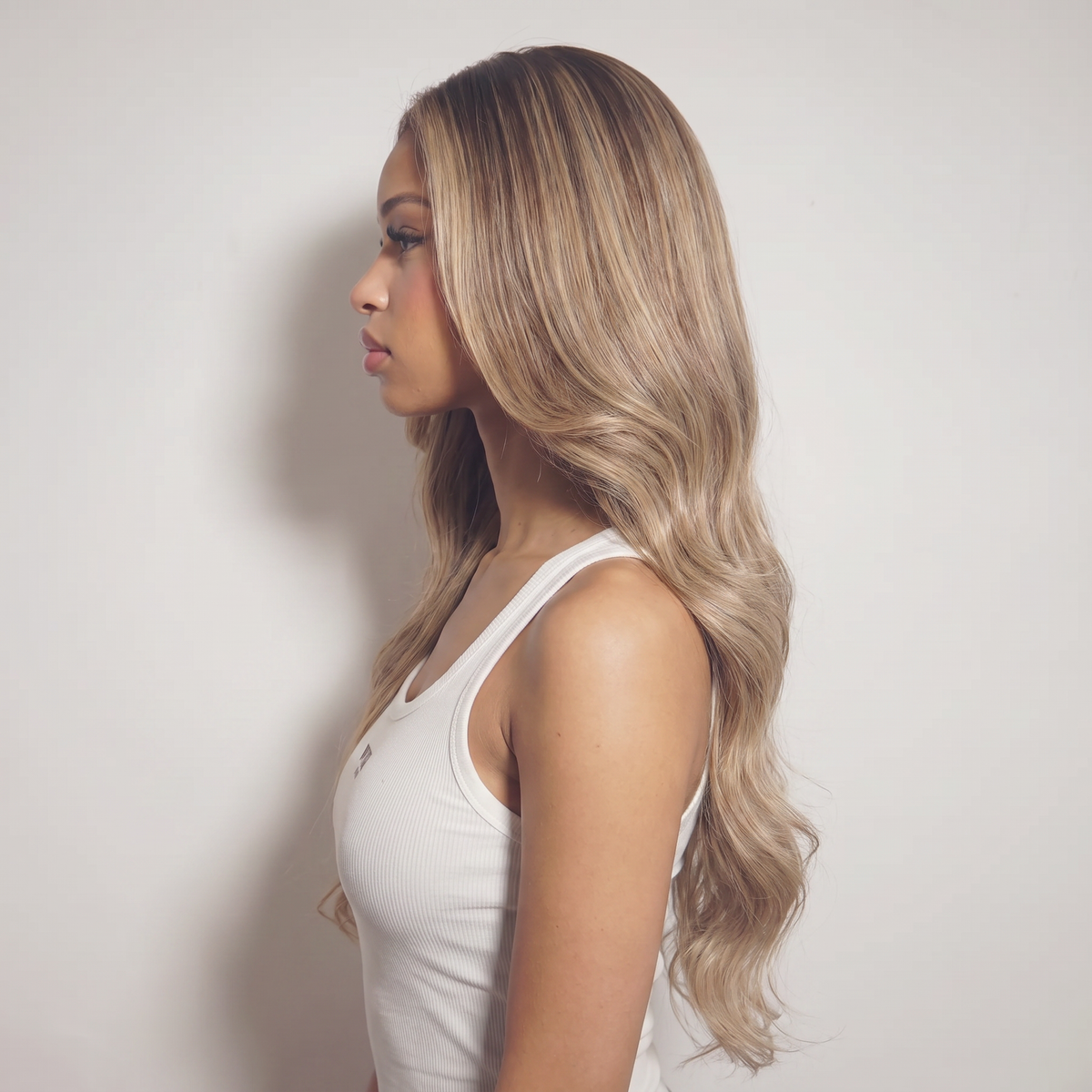 WIGZ 52 - Side profile view of layered WAVY HONEY BLONDE BALAYAGE virgin hair wig with WIGZ LAB CAP™.